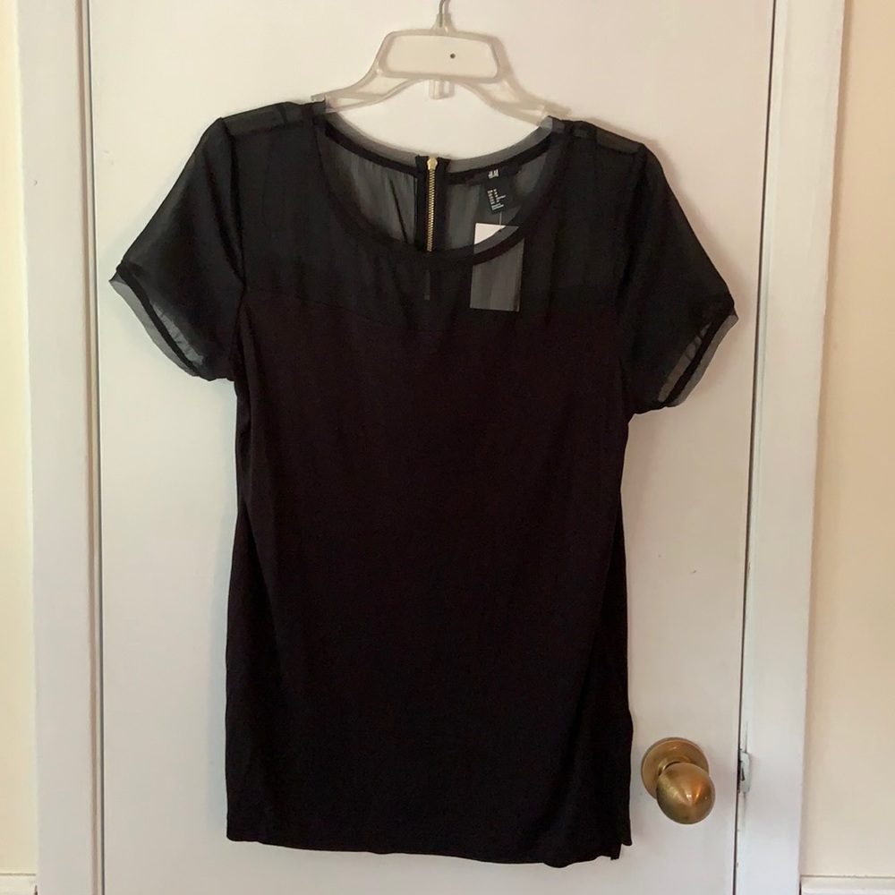 Ladies black top with sheer neckline and sleeves